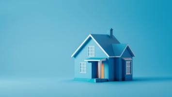 Une maison miniature de couleur bleue
