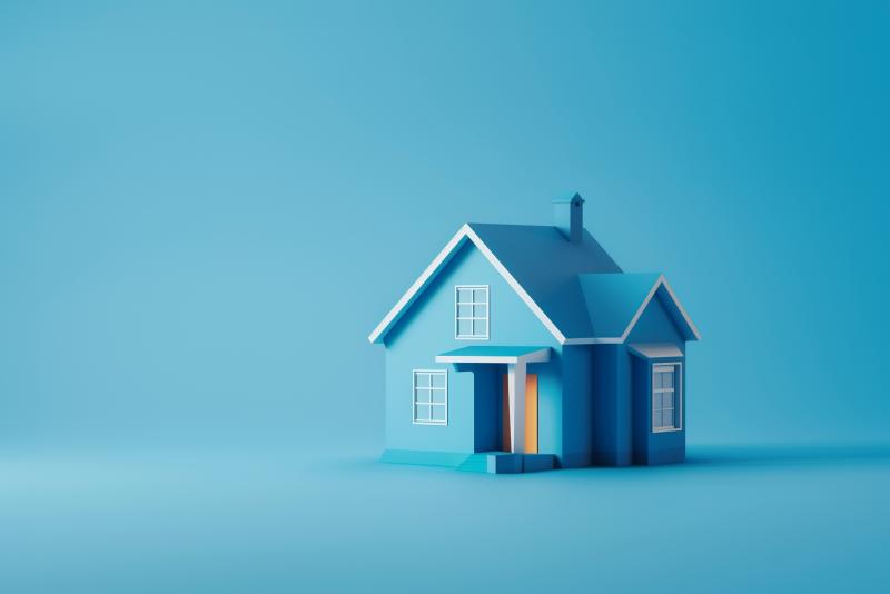 Une maison miniature de couleur bleue